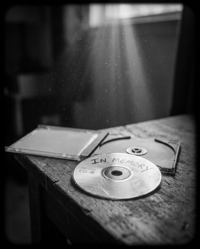 A hand-labelled CD-R beside an open jewel case