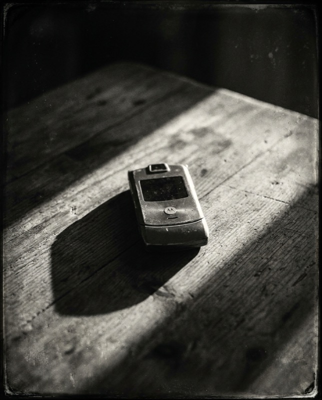 A flip phone lying closed